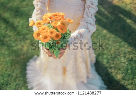 LLBride holds a wedding bouquet, wedding dress, wedding details, soft, focus on hands