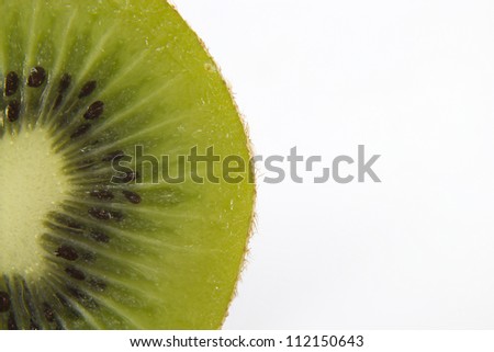 Close up of a green and healthy juicy kiwi on a white background.