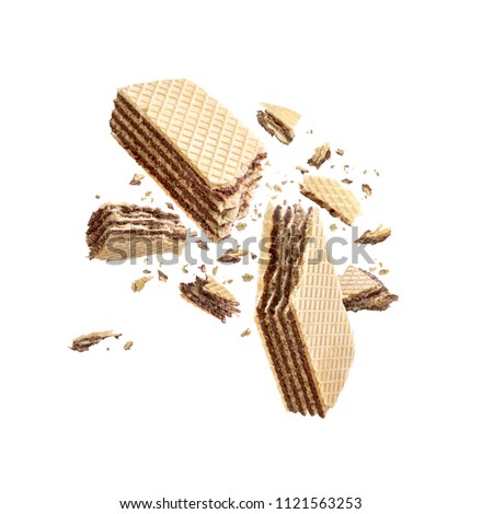 Waffles broken in half, isolated on white background Royalty-Free Stock Photo #1121563253