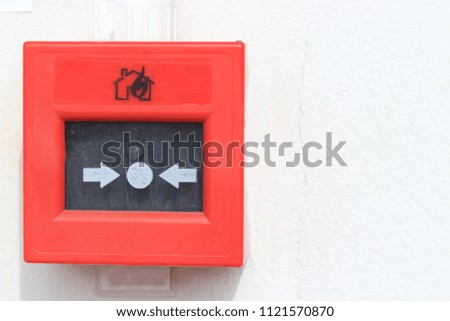 Red fire alarm panel box is on the wall.selective focus.