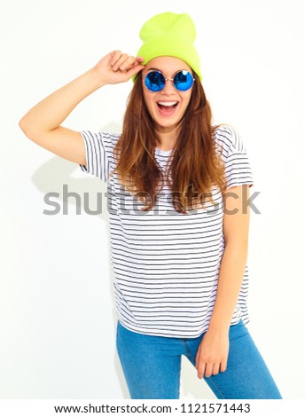 Portrait of young stylish girl model in casual summer clothes in yellow beanie hat. Isolated on white