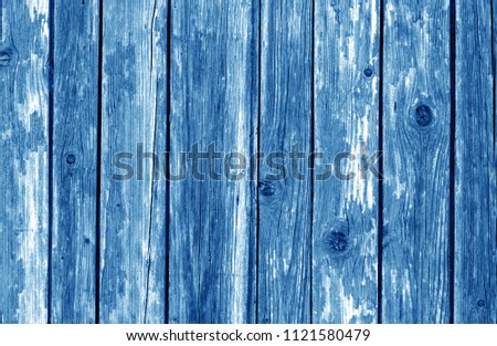 Old wooden fence pattern in navy blue color. Abstract background and texture for design.