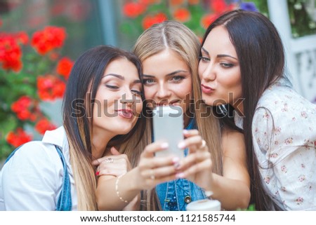 Group of young women making selfie