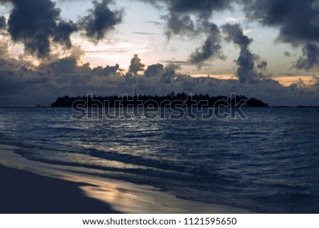 Maldive Islands. Ocean and sky. Waves and sand of the ocean. Background. Maldive. Summer. 