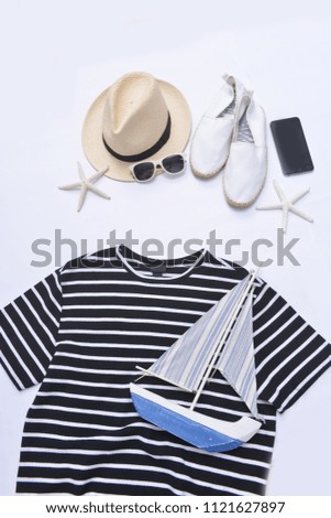 summer clothes collage on white -sunglasses,starfish, , hat, wooden boat ,shoes on flat lay, top view
