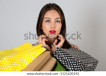 The women who is so happy cause she is doing shopping