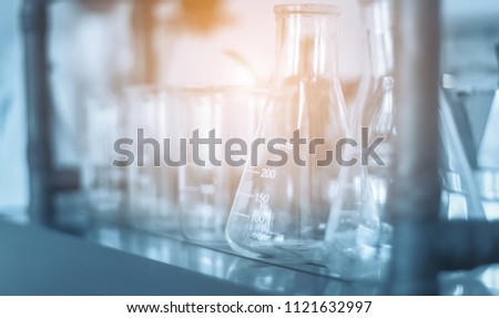 STEM education Laboratory beakers.Science experiment concept background. Royalty-Free Stock Photo #1121632997