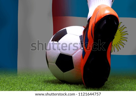 Close up legs and feet of soccer player or football player walk on green grass ready to play match on national France and national Argentine.