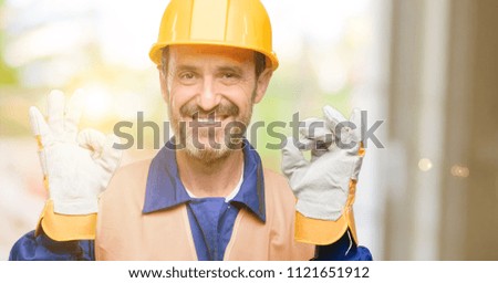 Senior engineer man, construction worker doing ok sign gesture with both hands expressing meditation and relaxation