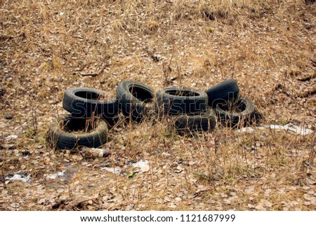 Old worn tires. Environmental pollution.