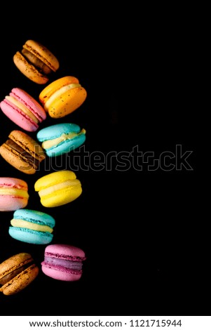 colorfull macarons black background,  flat lay   .pink color and ment color macaroons.top view.copy paste