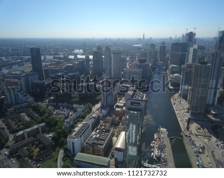 Aerial drone image of the Canary Wharf London Skyline on a bright sunny day.