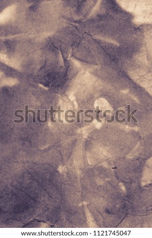 Blank aged paper sheet as old dirty frame background with dust and stains. Front view. Vintage and antique art concept. Detailed closeup studio shot. Black and white toned