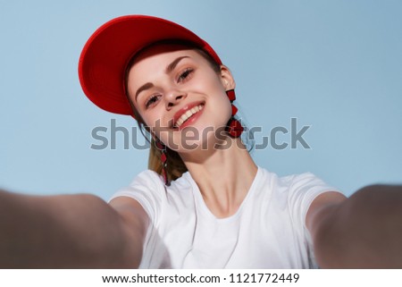   woman in a red smile smiling photographing herself                             