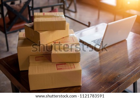 Packing accessories at workplace of startup small business owner, cardboard parcel box for online selling. entrepreneur,cardboard parcel box for online selling.shipping concept. Royalty-Free Stock Photo #1121783591