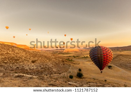 View of Hot air balloons flying in sunset sky over Cappadocia, Turkey.Copy space for editing