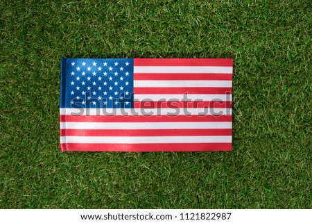 top view of american flag on green grass, 4th july holiday concept