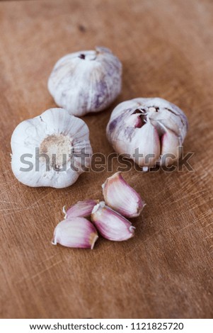 garlic head on wood board background