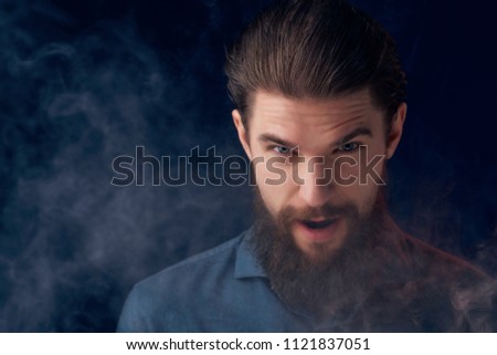   man with a beard of smoke style                             