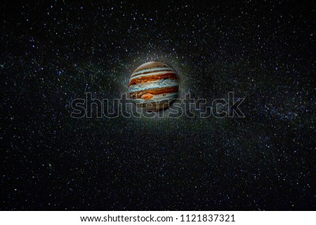 Planet Jupiter against the stars of the Milky Way. Elements of this image furnished by NASA