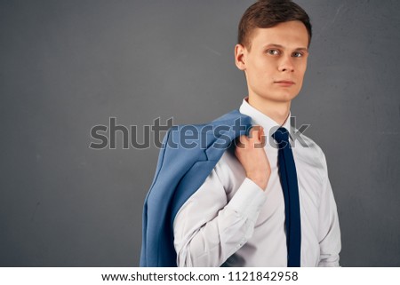 jacket in the man's hand                        