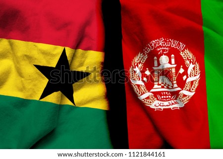 Ghana and Afghanistan flag on cloth texture
