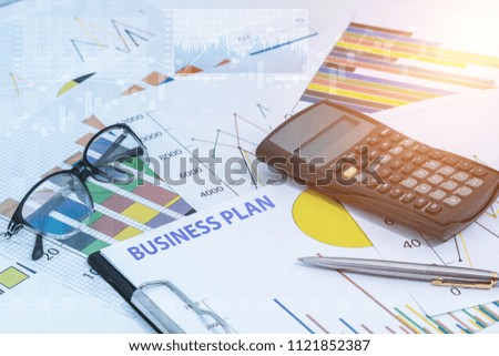 Business plan and business chart with calculator, pen, glasses. management budget planning, financial, education concepts