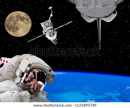 Astronaut in outer space, moon and spaceships on the backdrop. The elements of this image furnished by NASA.
