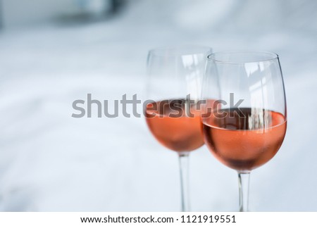 Two glass of rose wine with white background (selective focus) Royalty-Free Stock Photo #1121919551