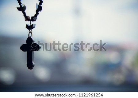 The Christian cross with blurred bokeh light background with morning sunlight, christian concept Jesus is the light of the world, Copy space for design.Vintage Tone.