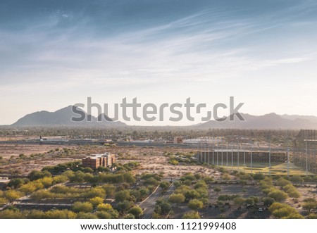High aerial view of Scottsdale Arizona facing west towards Camelback Mountain near the 101 Highway.  