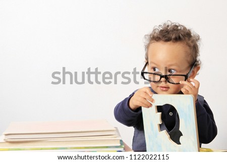 little boy reading book with glasses at school with white background stock image and stock photo