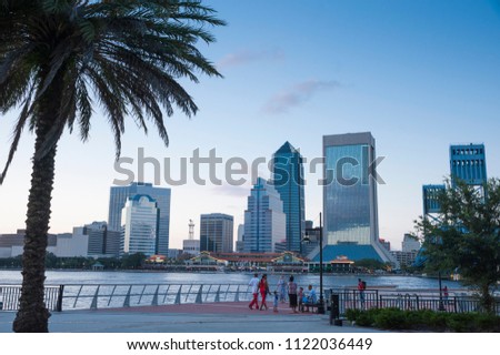 The Jacksonville skyline can be seen across the water as dusk approaches.