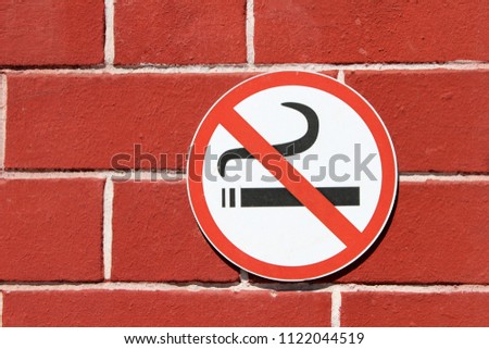 Sign of stop smoking nicotine sigarette on wall