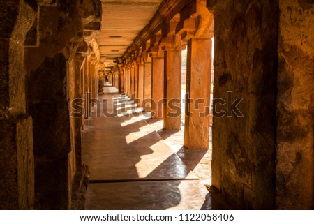 Beautiful view of hallway full of columns at an Indian ancient temple, Brihadeshwara temple, Thanjavur, Tamil Nadu, India