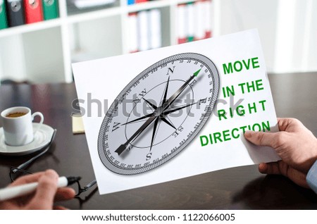 Hand holding a paper showing right direction concept