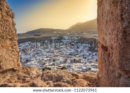 Amazing view of Lindos village, Rhodes island, Dodecanese, Greece. Sunset panorama inside the Castle. One of the most famous tourist destination in South Europe.