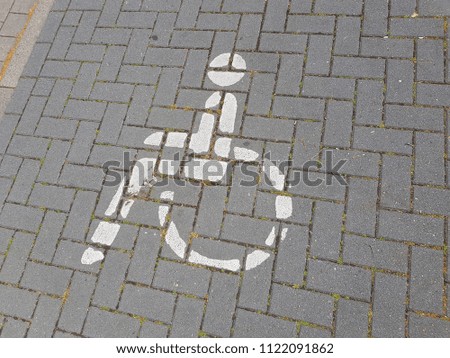 the symbol handicapped on a parking space