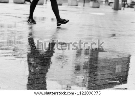 Rainy day. Go for a walk. Go your own way. Time is money. Monday morning. Sad people. Sad mood. On foot. Walking alone. Raining.