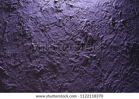blue rough plaster on the wall