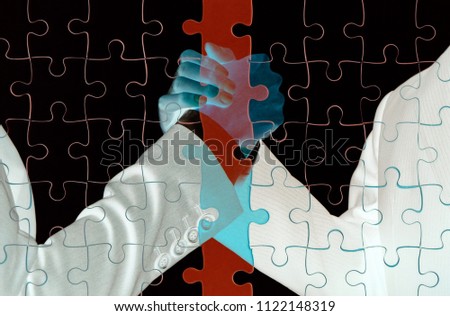 Double exposure of Business people gripping hands on jigsaw puzzle. Illegal business and connection concept.