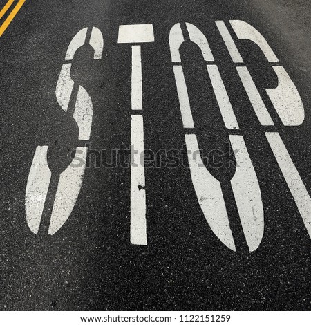 Stop and Double Yellow Line on Street at Intersection 