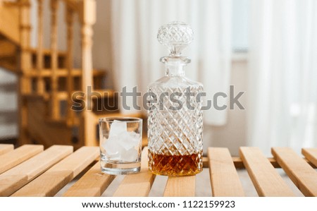 overhead view of a glass and bottle of whiskey
