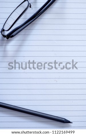 A studio photo of a note book pad