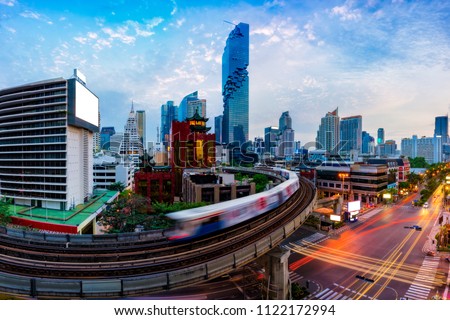 Aerial view of Bangkok modern office buildings and condominium in Bangkok city downtown with blue sky and clouds at Bangkok, Thailand. BTS skytrain Royalty-Free Stock Photo #1122172994