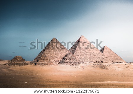 The Ancient pyramids of Egypt standing tall and proud in the hot sun