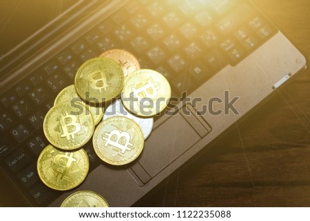 close up gold bitcoin on notebook, saving money for future, ethereum cryptocurrency, blockchain business technology concept
