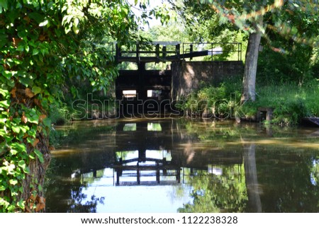 A Canal Lock on the Wey and Arun  canal in England in summertime
