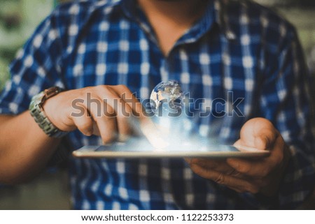 Hands pointing modern digital tablet, global network connection and future education technology. Element of this image are furnished by NASA