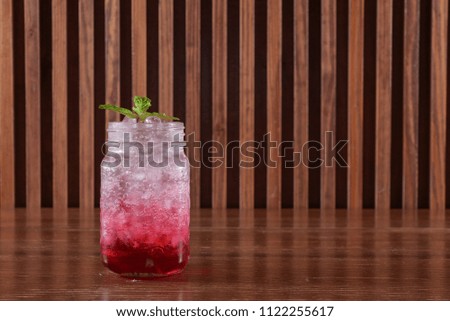 Red soda on wood table